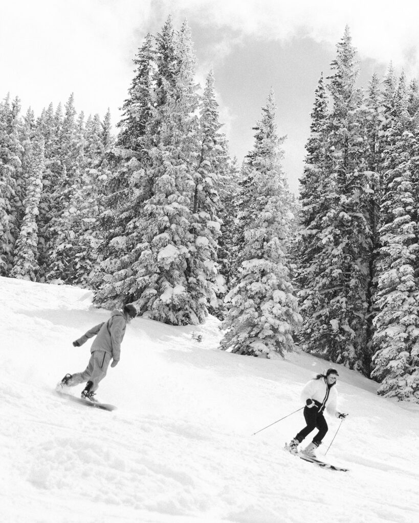 Action shots during some snowy ski engagement photos in Colorado