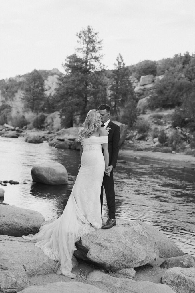Bride and groom portraits by the Arkansas River at Surf Hotel and Chateau