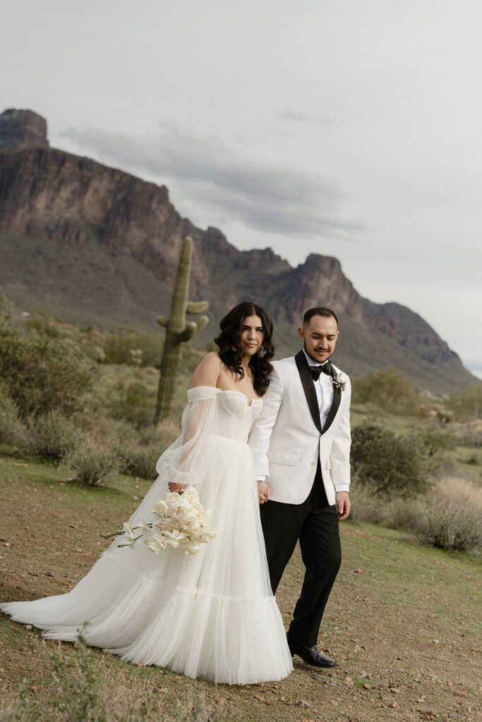 Bride and groom with Superstition Mountains in the background