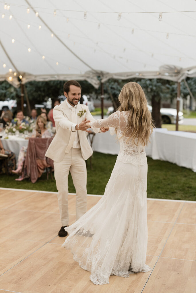 bride and groom dance at their Coastal cowgirl inspired wedding reception