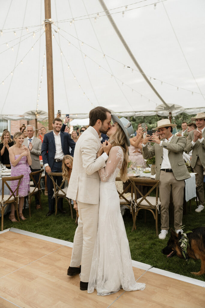 bride and groom dance at their Coastal cowgirl inspired wedding reception