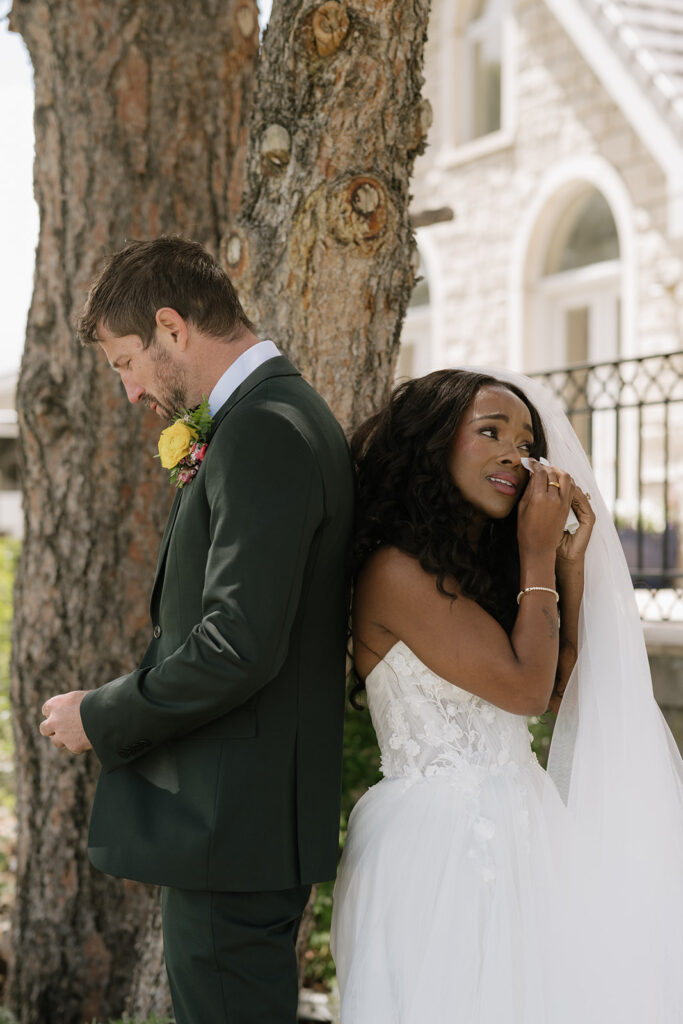 Bride and groom first touch at Greystone Castle in Boulder, Colorado