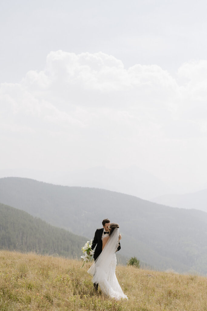 Vail Mountain wedding portraits of bride and groom in smoky haze