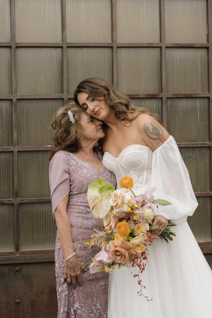 Bride and her mother stand together
