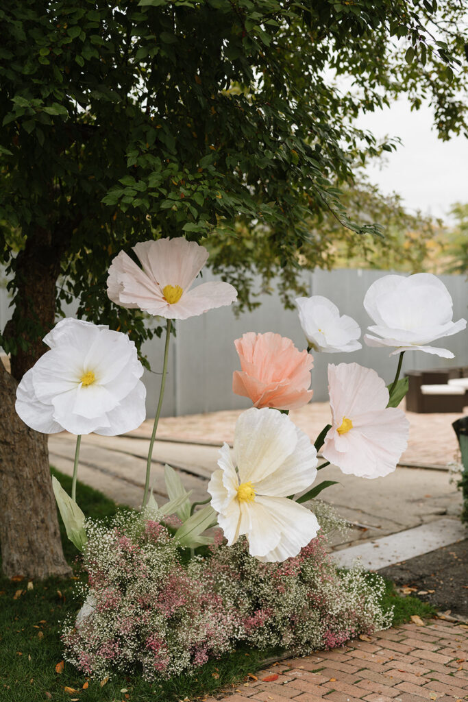 Giant paper flowers at the altar