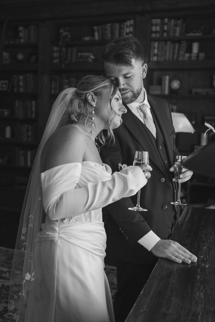 Bride and groom share champagne together in private