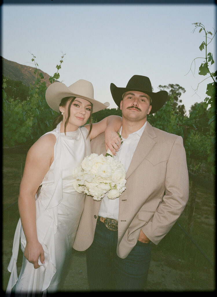 Bride and groom captured on 35mm film at Rancho Guejito vineyards