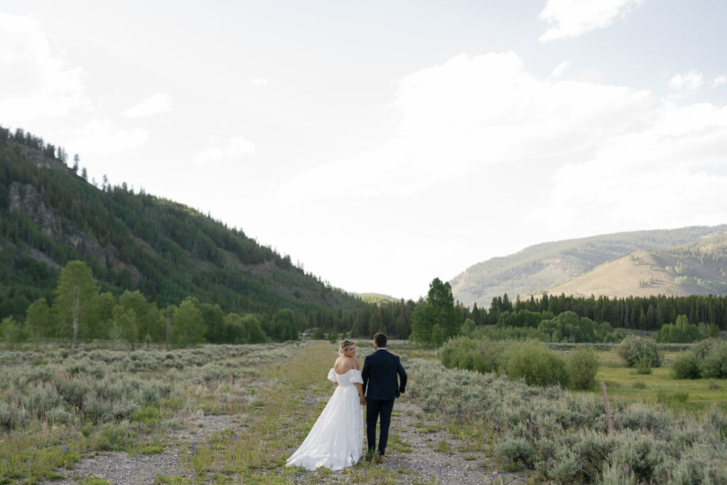 Bride and groom with Colorado mountains in the backdrop