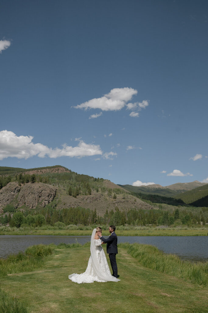 Bride and groom with Colorado mountains in the backdrop