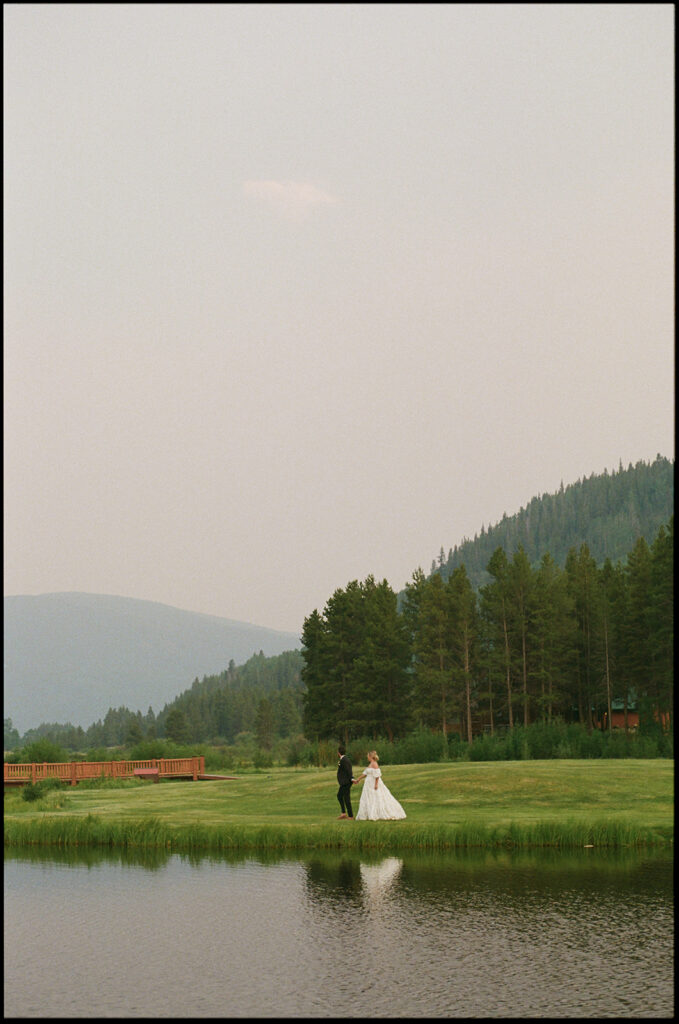 Bride and groom with Colorado mountains in the backdrop